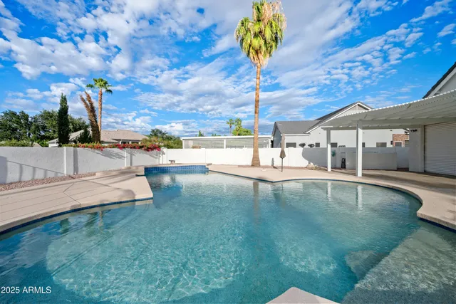 a view of a swimming pool with a sitting area