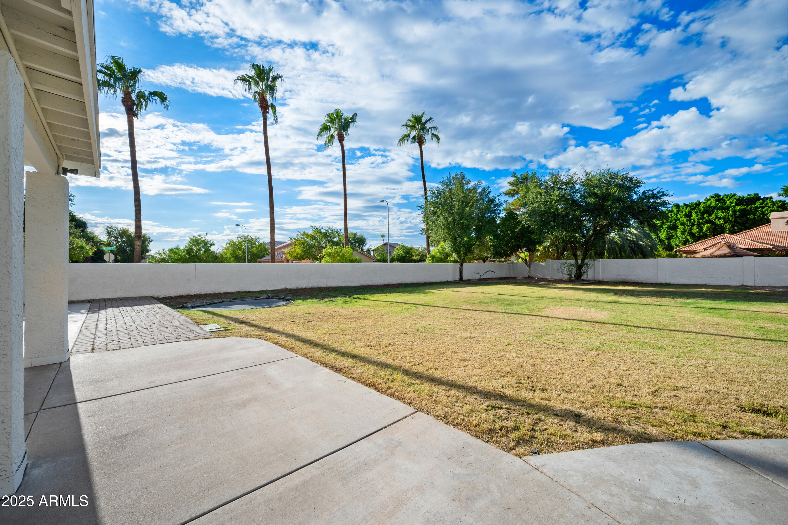 4352 East Santa Rosa Place Gilbert, AZ 85234 - Photo 40 of 53 a view of a swimming pool with a yard