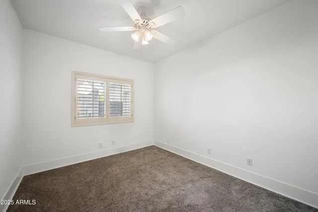 a kitchen with a stove sink and wooden floor