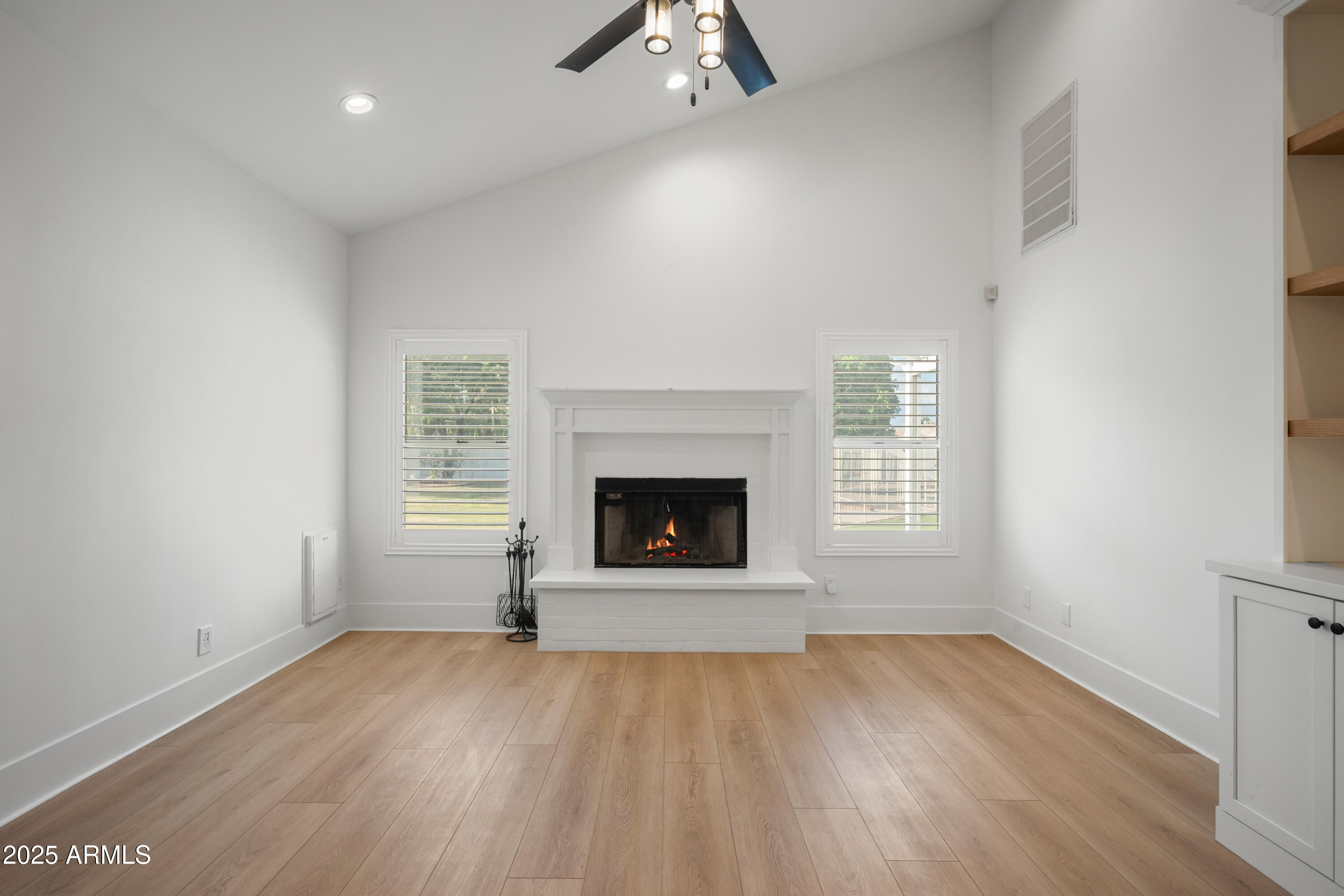 4352 East Santa Rosa Place Gilbert, AZ 85234 - Photo 43 of 53 an empty room with windows and fireplace