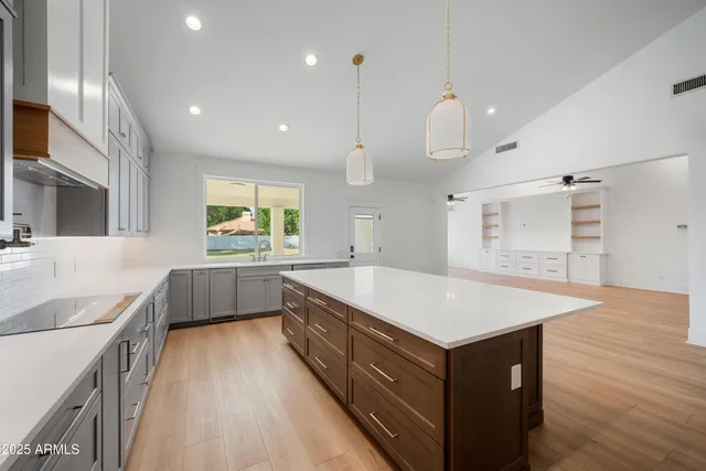 a view of a swimming pool with yard and porch area