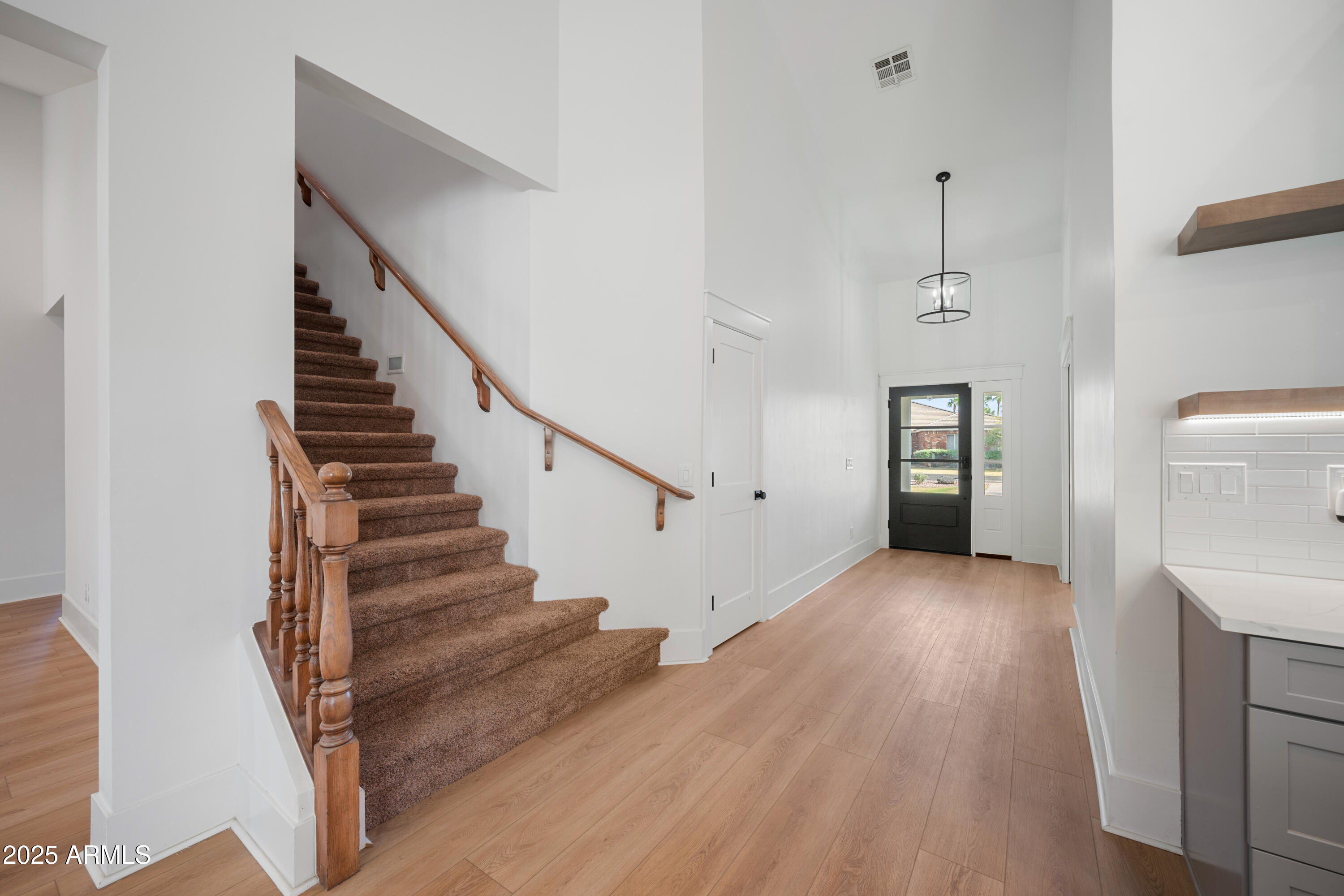 4352 East Santa Rosa Place Gilbert, AZ 85234 - Photo 7 of 53 a view of entryway and hall with wooden floor
