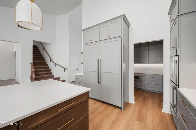 a kitchen with a refrigerator and a sink