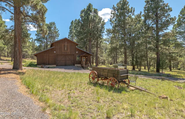 a view of house with outdoor space and deck