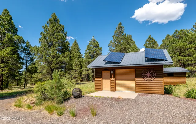 a swimming pool with outdoor seating and yard
