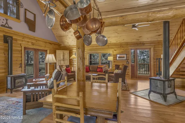 a bedroom with furniture and a large window