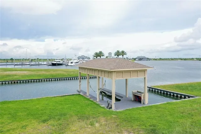 a view of a house with swimming pool and sitting area