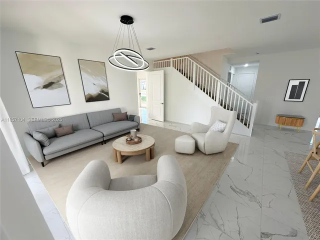 a living room with furniture and a table