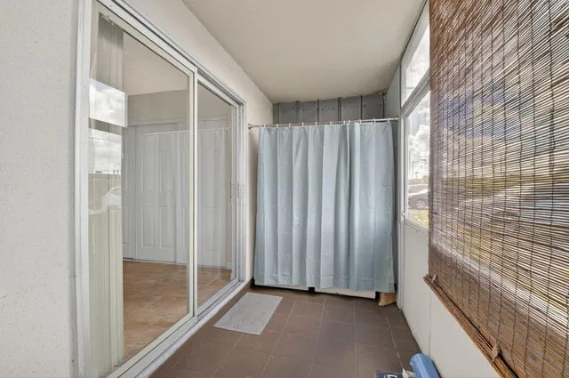 a view of a bathroom with shower