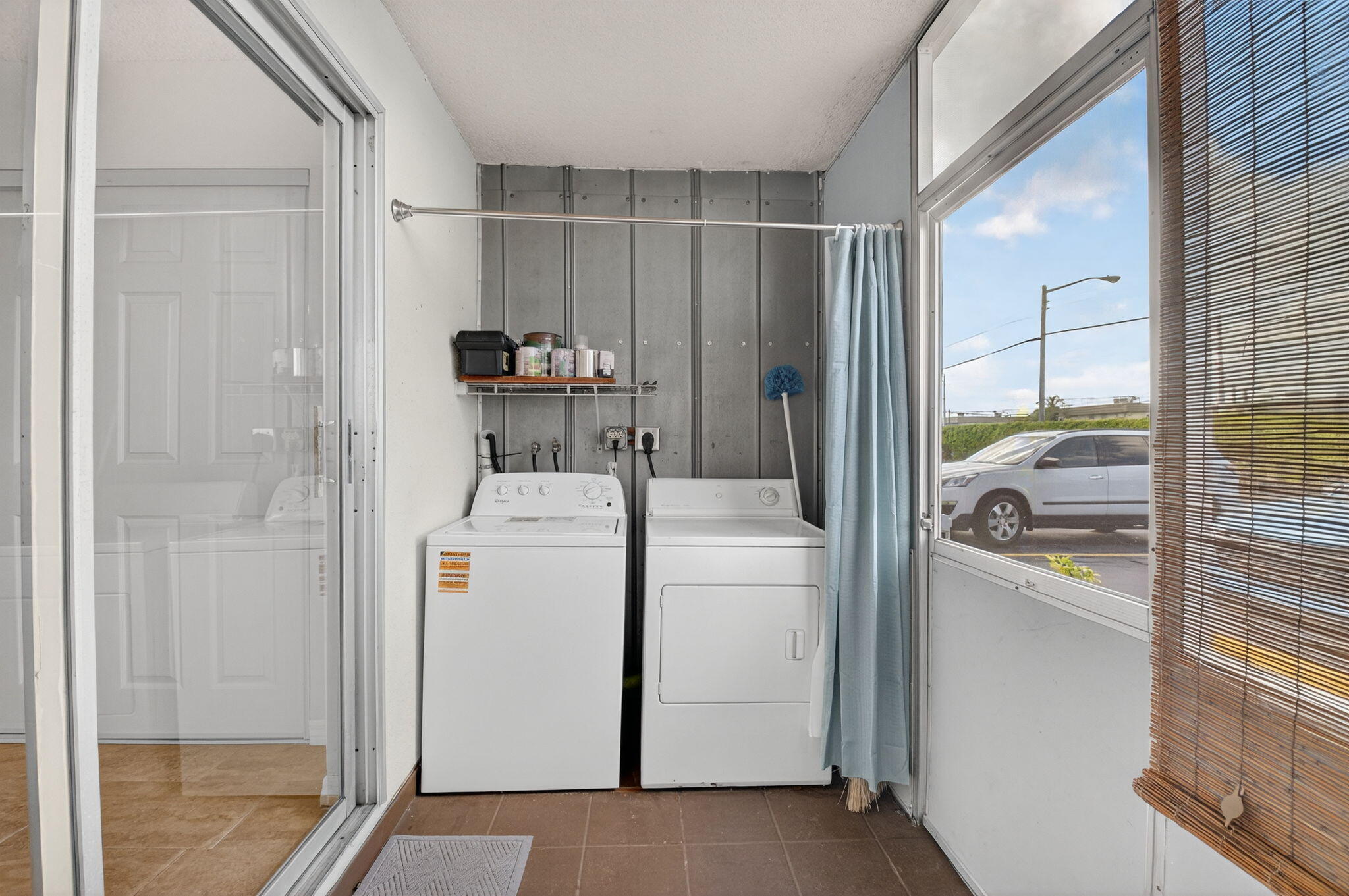 51 Flanders B Delray Beach, FL 33484 - Photo 18 of 42 a storage room with washer and dryer