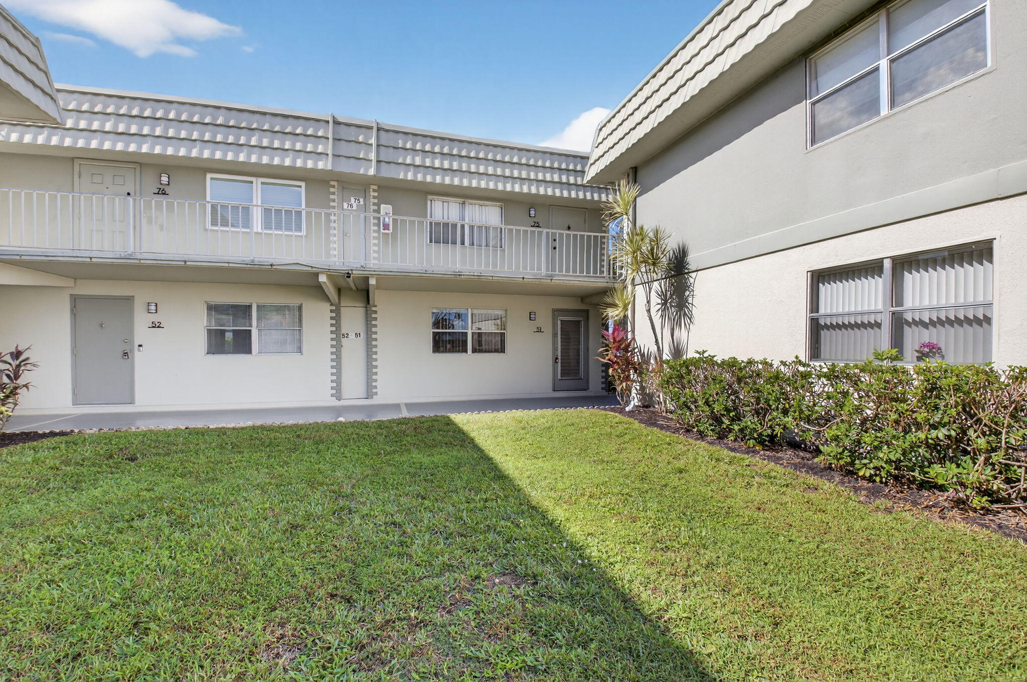 51 Flanders B Delray Beach, FL 33484 - Photo 21 of 42 a view of a back yard of the house