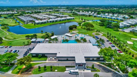 an aerial view of a house with a swimming pool