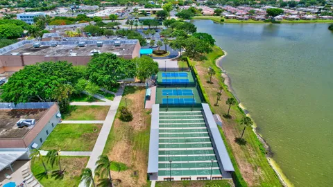 an aerial view of residential house with outdoor space and swimming pool
