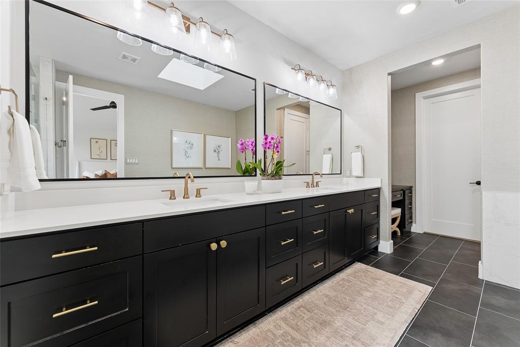 3922 Redding Row Dallas, TX 75220 - Photo 24 of 35 a bathroom with a double vanity sink and a mirror