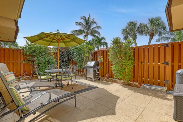 a view of a backyard with a patio