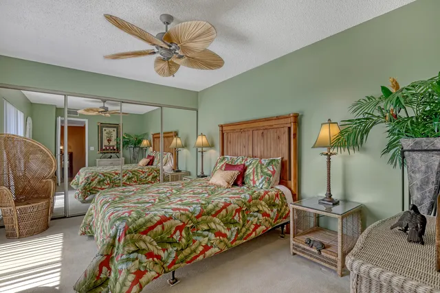 a bed room with a bed and a chandelier