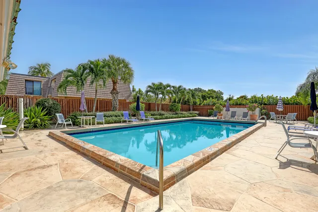 a view of swimming pool with chairs