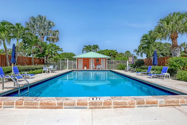 a view of swimming pool with outdoor seating and yard