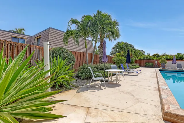 a view of a backyard with a patio