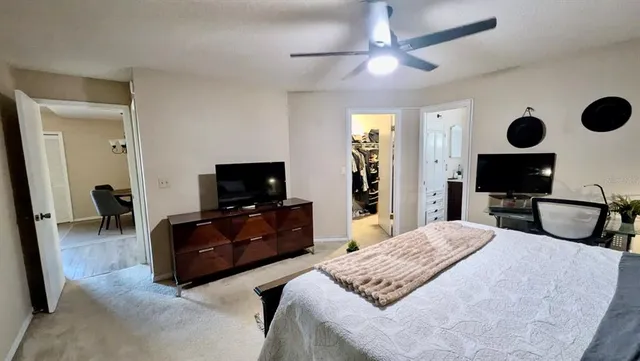 a bedroom with a bed and furniture