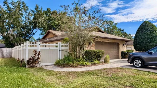 a view of a house with a yard