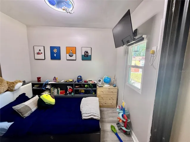 a living room with furniture and a window