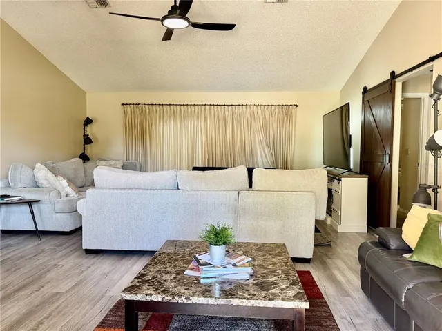 a living room with furniture and a couch
