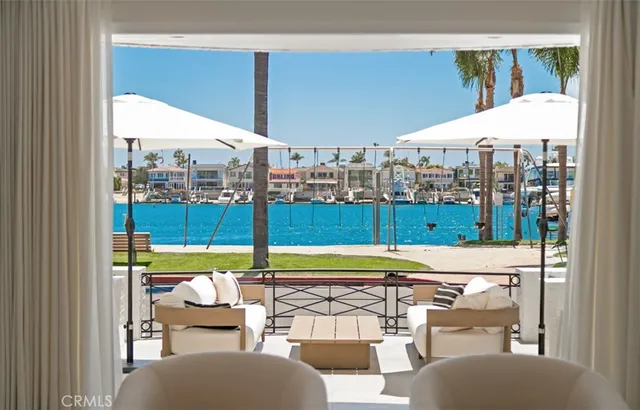 a view of a balcony with a table and chairs