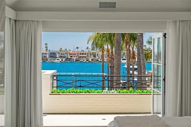 a large bathroom with a granite countertop double vanity sink a mirror and a bathtub