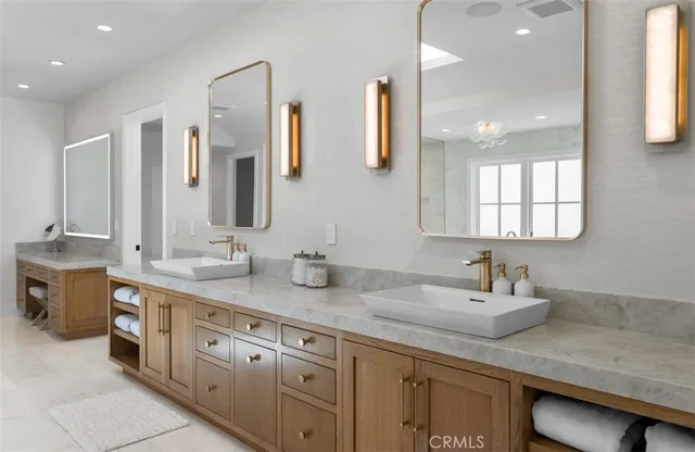 a view of a hallway with wooden floor and chandelier