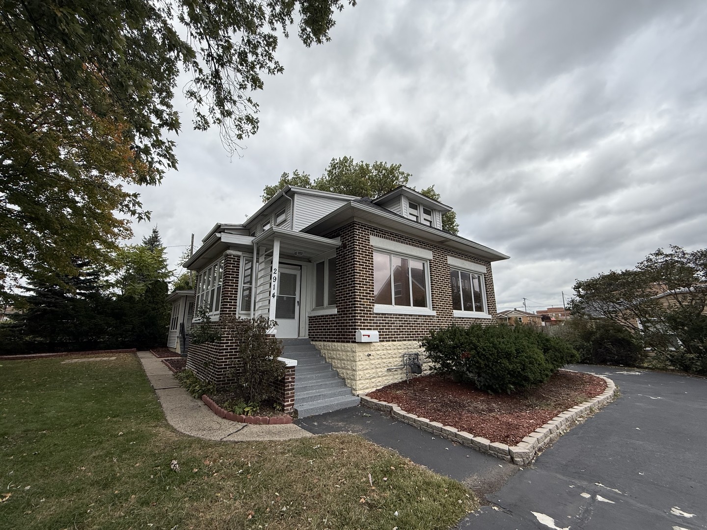 2914 Ridge Road Lansing, IL 60438 - Photo 1 of 32 a front view of a house with yard and green space