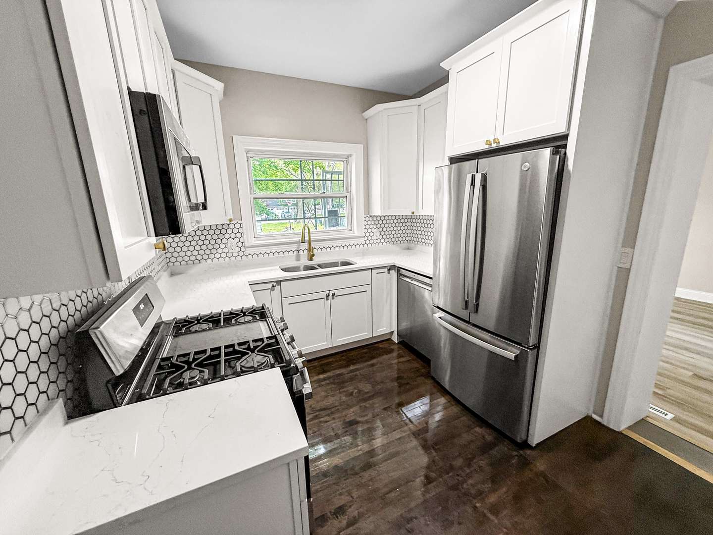 2914 Ridge Road Lansing, IL 60438 - Photo 12 of 32 a kitchen with a refrigerator sink and window