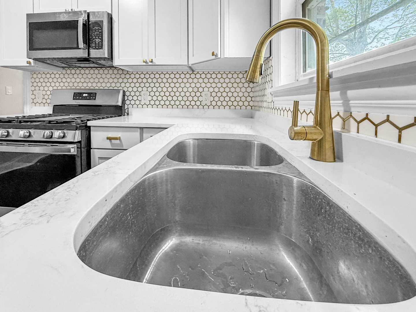 2914 Ridge Road Lansing, IL 60438 - Photo 13 of 32 a kitchen with a sink a stove and cabinets