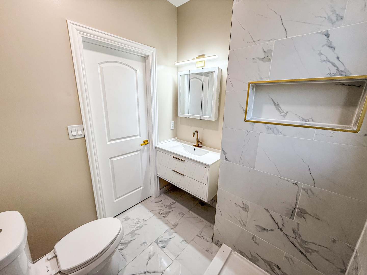 2914 Ridge Road Lansing, IL 60438 - Photo 10 of 32 a bathroom with a sink a toilet and mirror