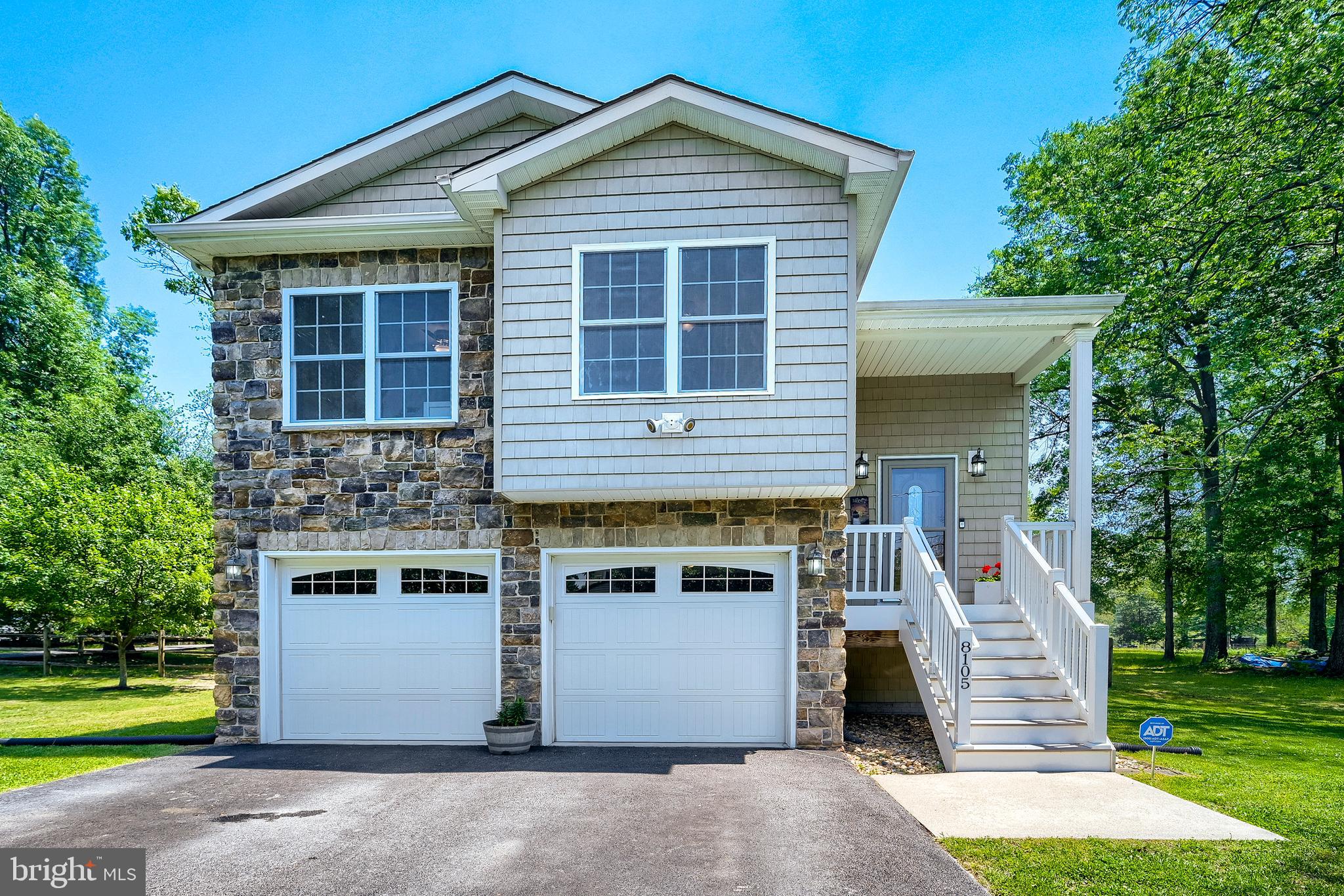 Stone and vinyl maintenance free exterior