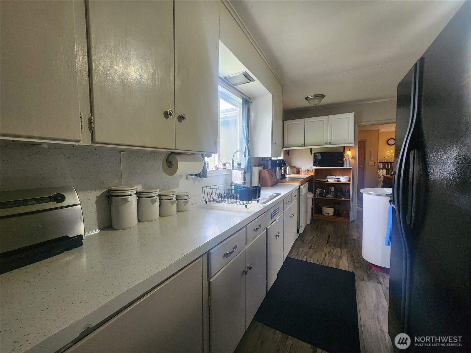117 J Street Cosmopolis, WA 98537 - Photo 12 of 30 a kitchen with stainless steel appliances a sink stove and refrigerator