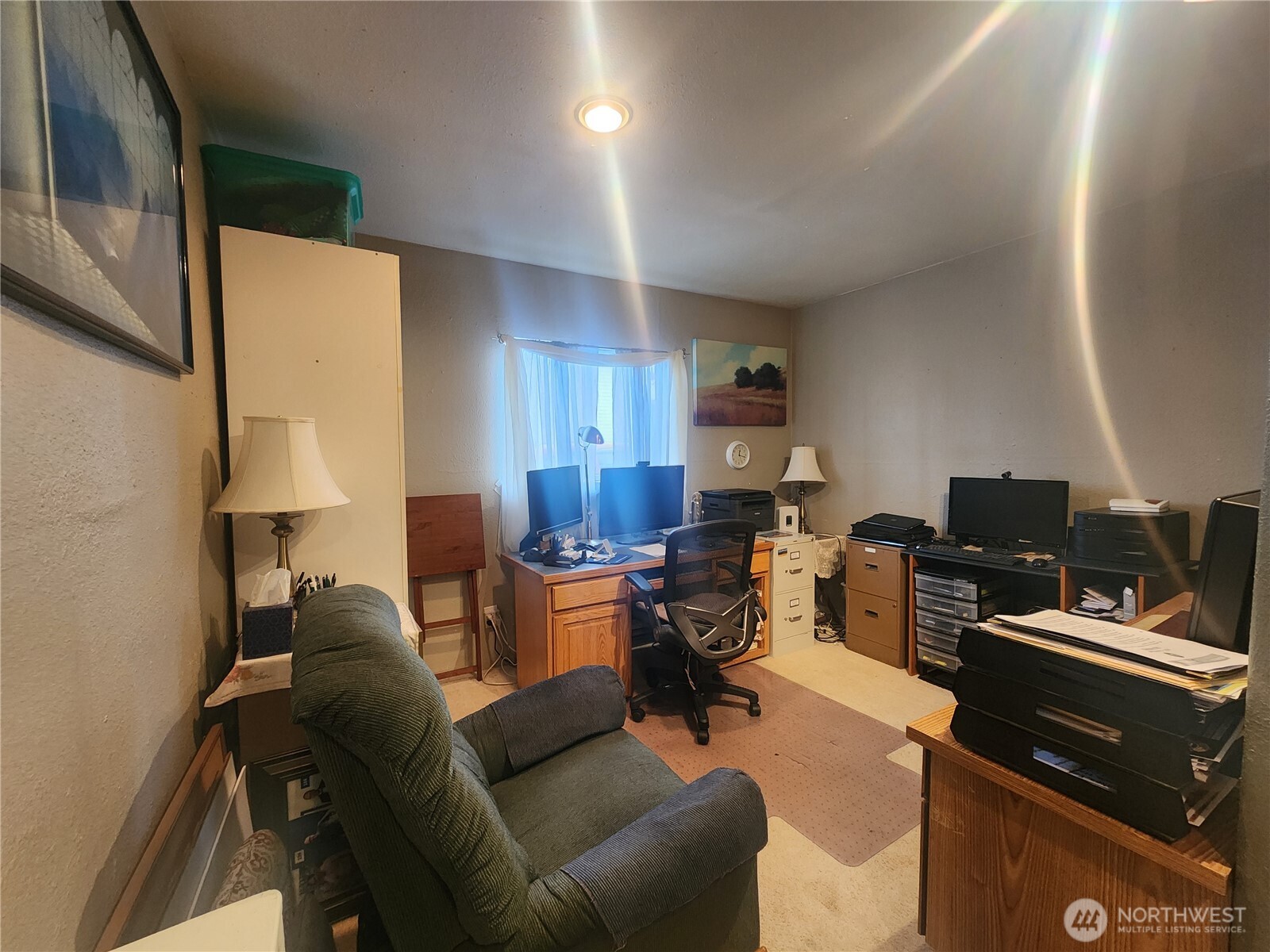 117 J Street Cosmopolis, WA 98537 - Photo 19 of 30 a living room with furniture a fireplace and a flat screen tv