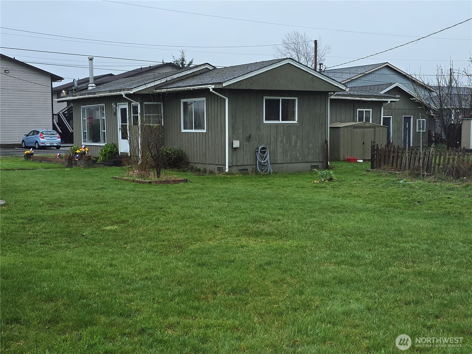 117 J Street Cosmopolis, WA 98537 - Photo 28 of 30 a front view of a house with a garden