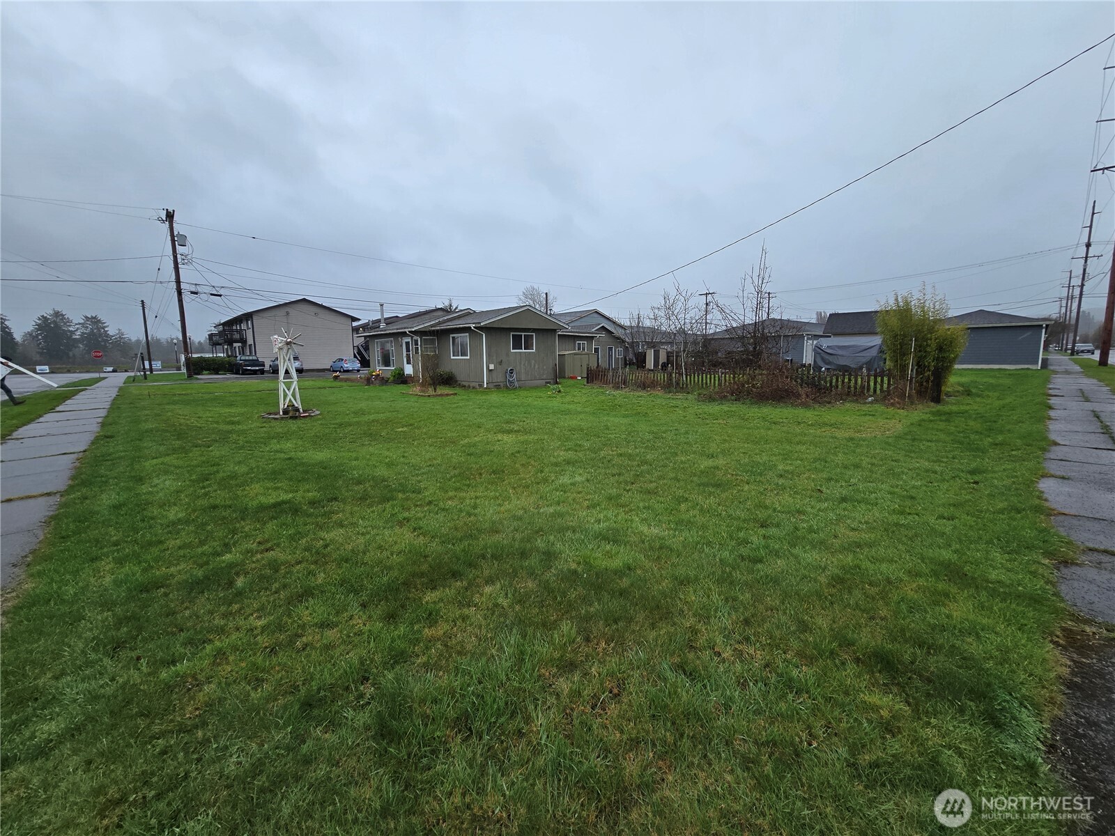 117 J Street Cosmopolis, WA 98537 - Photo 30 of 30 a view of a garden with a building in the background