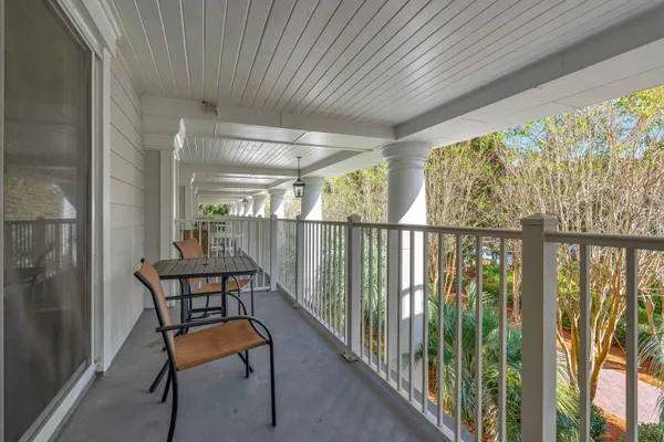 a view of a balcony with furniture