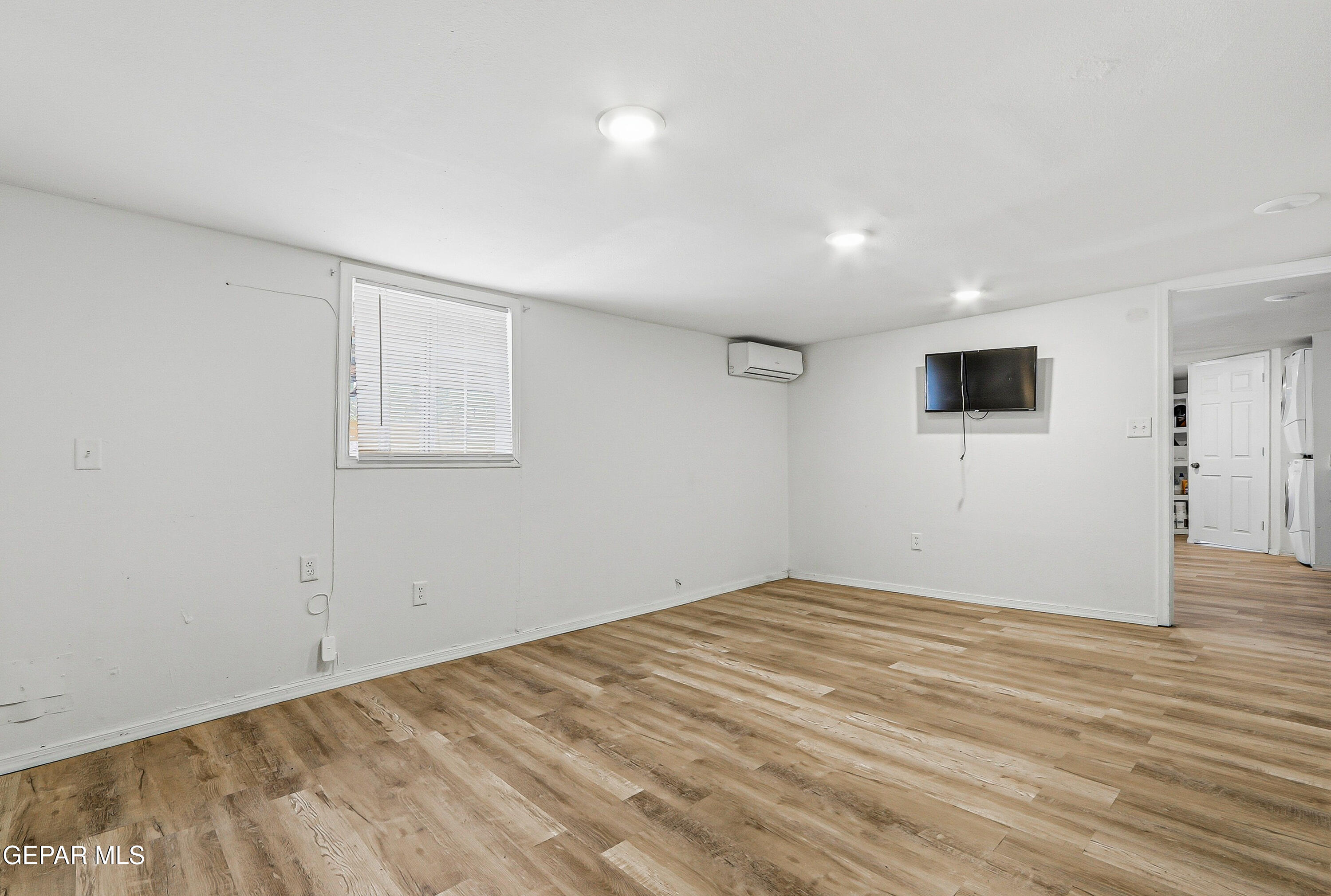 11548 Jenny Road Socorro, TX 79927 - Photo 15 of 39 a view of empty room with wooden floor