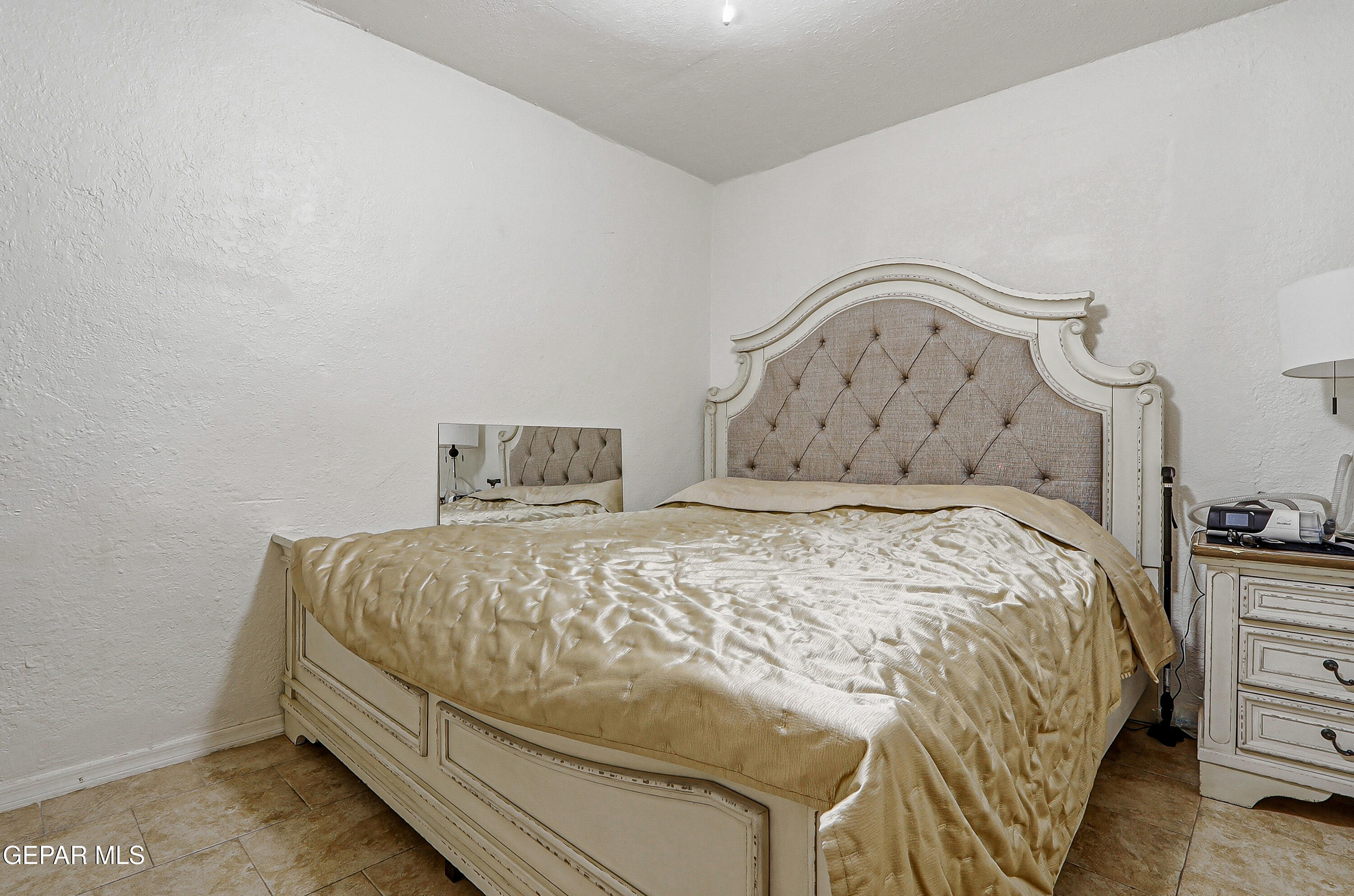 11548 Jenny Road Socorro, TX 79927 - Photo 27 of 39 a bedroom with a bed and dresser