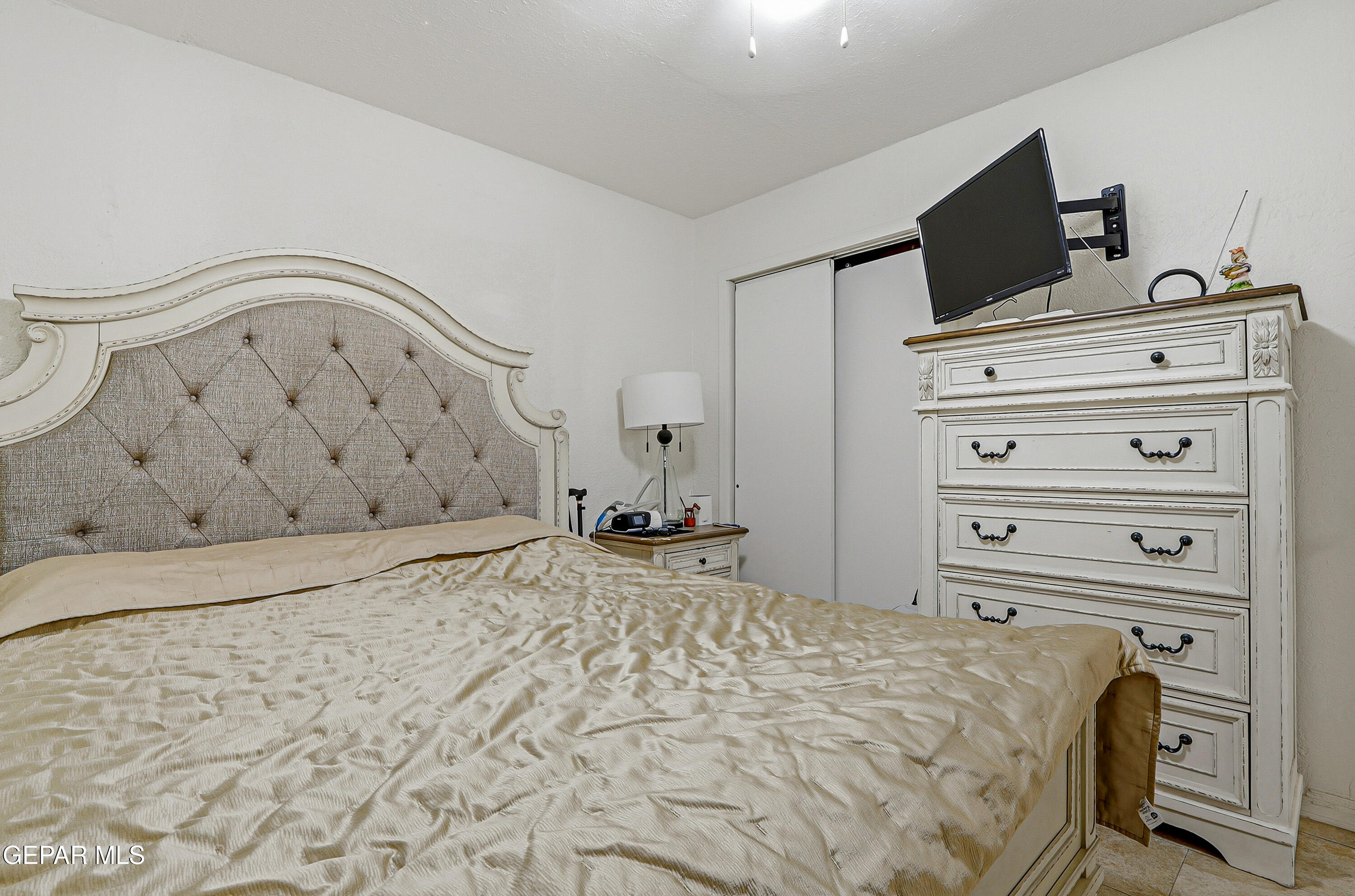 11548 Jenny Road Socorro, TX 79927 - Photo 28 of 39 a bedroom with a bed and a television