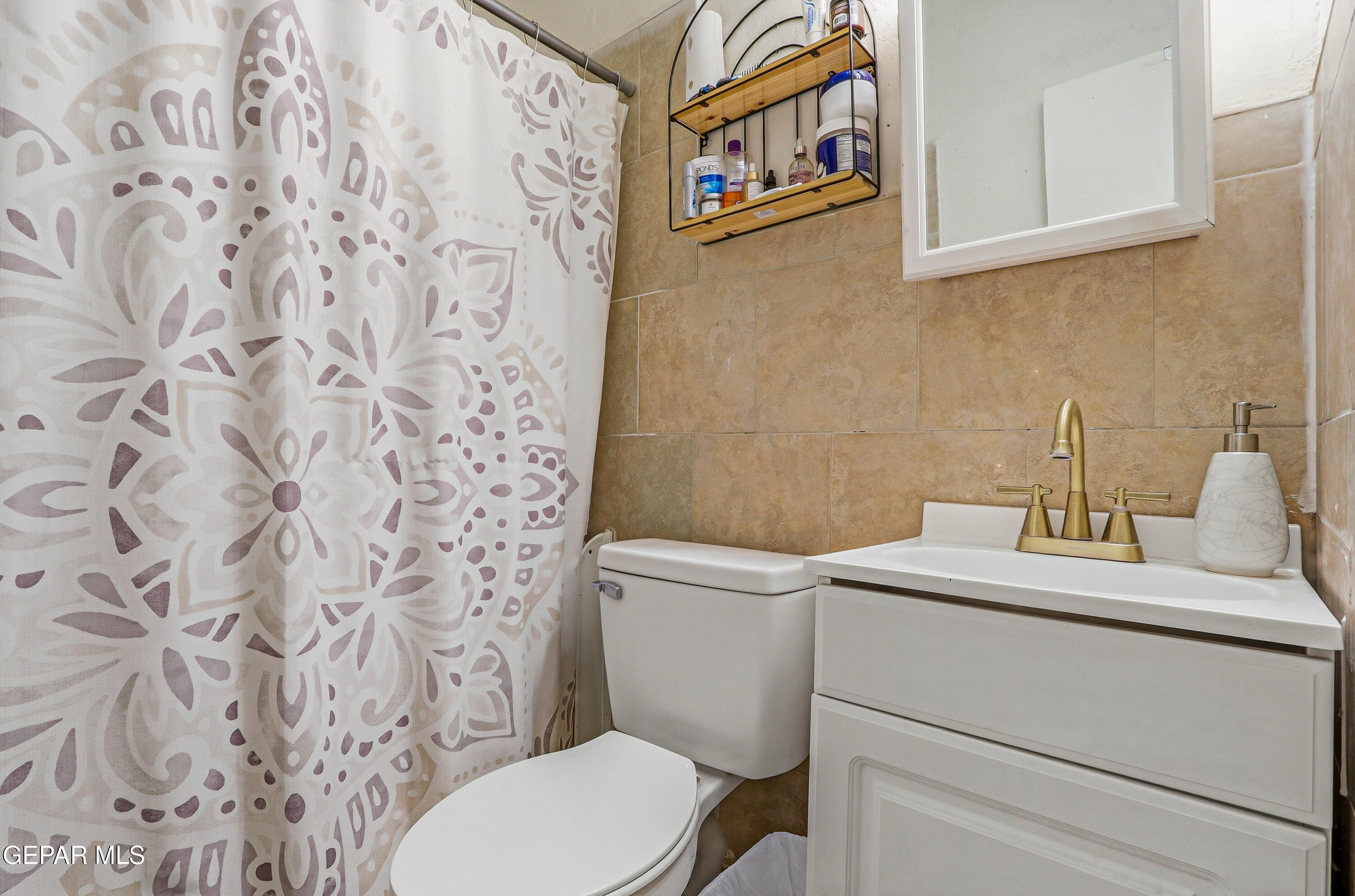 11548 Jenny Road Socorro, TX 79927 - Photo 30 of 39 a bathroom with a toilet and a sink