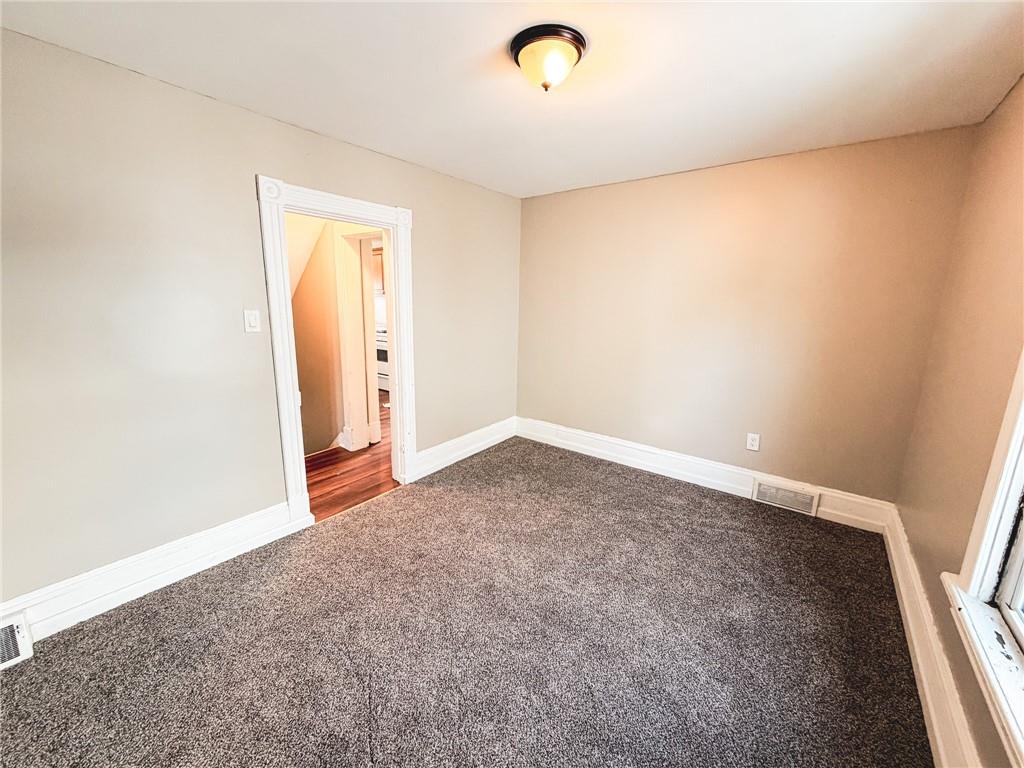 330 12th Avenue, Unit 2 New Brighton, PA 15066 - Photo 12 of 17 an empty room with windows and closet