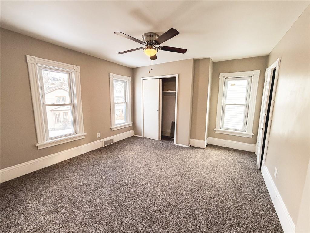 330 12th Avenue, Unit 2 New Brighton, PA 15066 - Photo 13 of 17 a view of a livingroom with a ceiling fan and window