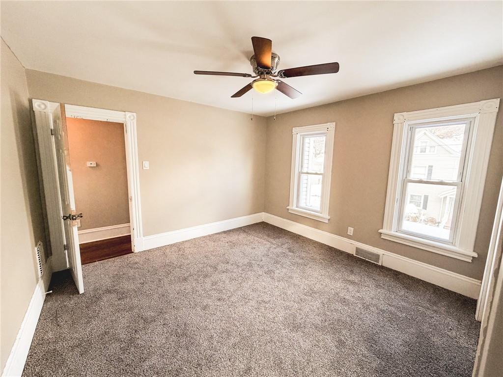 330 12th Avenue, Unit 2 New Brighton, PA 15066 - Photo 14 of 17 an empty room with windows and fan