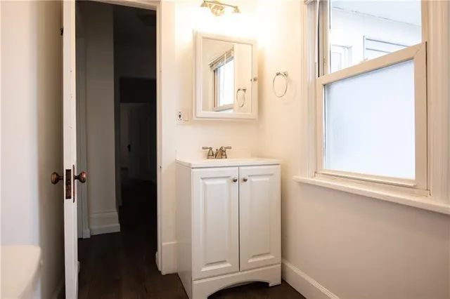 a view of cabinets and a window