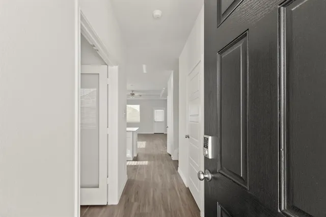 a view of a bathroom from a hallway