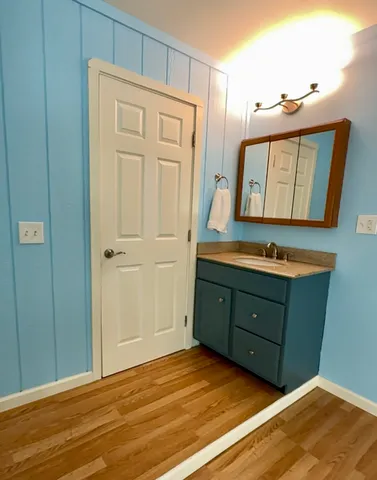 a room with cabinets and wooden floor